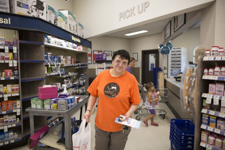 Helen Tucker picks up prescription medications last month in Virginia Beach, Va. Without health insurance, she's paying for her medical expenses out of pocket.